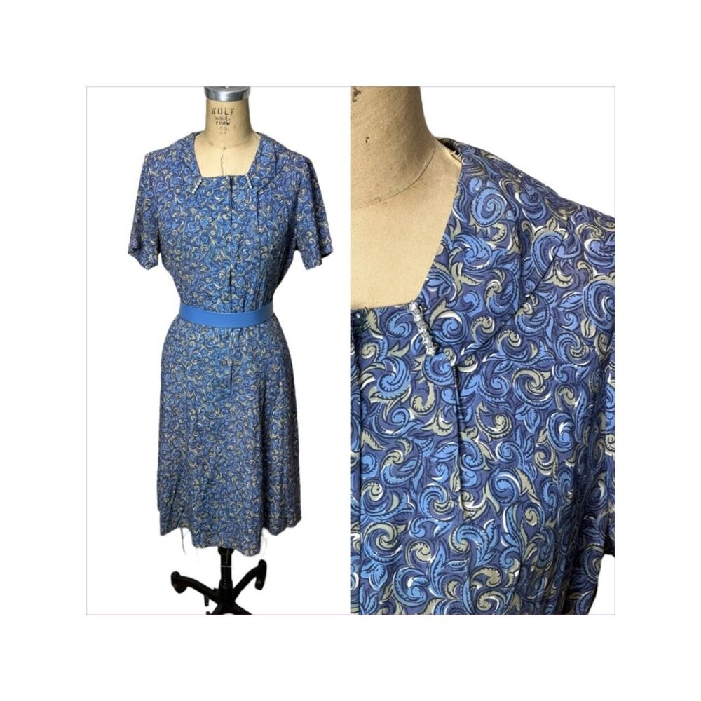 1950s blue shirtdress in blue swirly pattern with rhinestone pins at collar